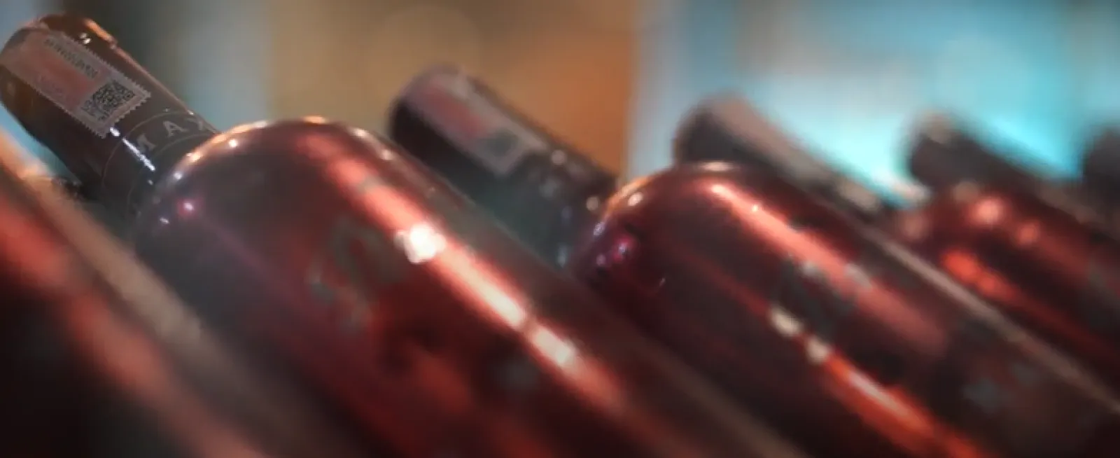 Soft focus close up of wine bottles.